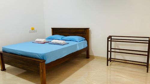 a bedroom with a bed with two towels on it at Elisha Place Hiriketiya in Dickwella
