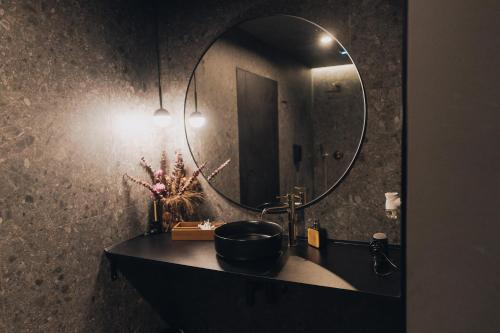 a bathroom with a sink and a mirror at SPA SPA Opletalova in Prague