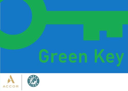 an image of a green key with the text green key at ibis Styles Basel City in Basel