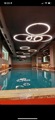a large swimming pool in a building with a swimming pool at Kartal ist marina in Istanbul