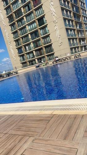 a swimming pool in front of two tall buildings at Kartal ist marina in Istanbul