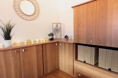 a large wooden cabinet with a mirror on the wall at Bella vista lago e parcheggio privato - Acquaseria centro in Acquaseria