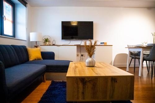 a living room with a couch and a coffee table at Close To Leeds City, Spacious, Sleeps 4, in Beeston Hill