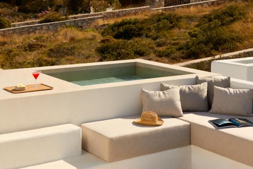 a tub on the back of a boat with a hat at PAROCKS Luxury Hotel & Spa in Ambelas