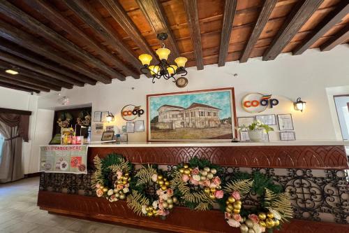 a restaurant with a counter with fruit on it at NSCC Casa De Vigan in Vigan
