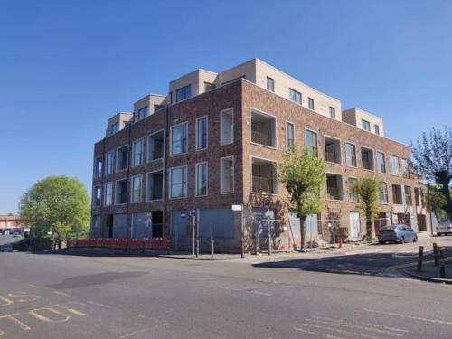 a large brick building on the corner of a street at London Luxe: Stylish Studio in London
