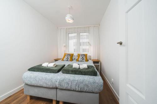 a bedroom with a large bed in a room at Close to everywhere, cosy place in Krakow