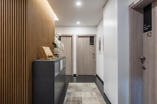 a room with a hallway with a console and a door at Boavista Executive Studios in Porto