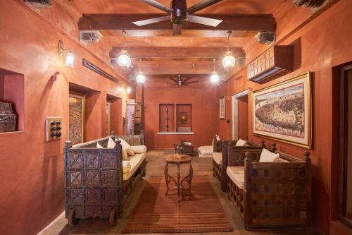 a living room with couches and a ceiling at Kaladwas Lal Haveli - A Heritage Boutique Hotel in Udaipur