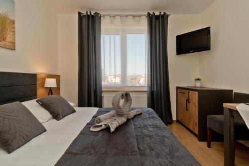 Postel nebo postele na pokoji v ubytování AGAT Jastrzębia Góra