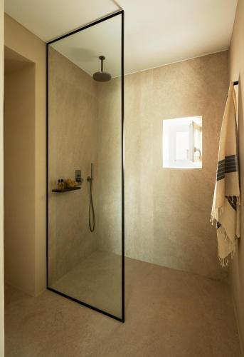 a shower with a glass door in a bathroom at PAROCKS Luxury Hotel & Spa in Ambelas