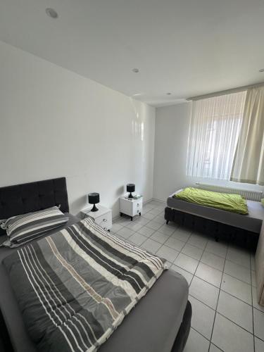 Postel nebo postele na pokoji v ubytování Heidelberg Apartments