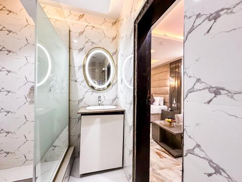 a bathroom with a sink and a mirror at Parkview Astoria Hotel in Lagos