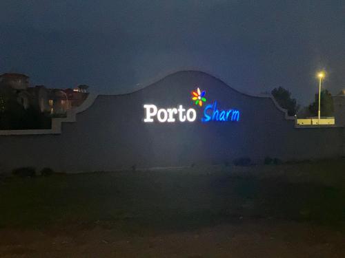 a sign for a porto shanghai at night at Porto Sharm 2024 in Sharm El Sheikh