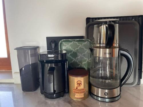 a group of appliances sitting on top of a counter at Doğa da bir ev… in Ürgüp