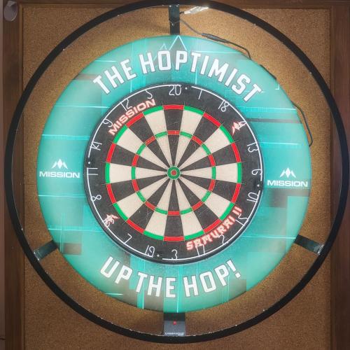 a dart board with the hop sign on a wall at The Hoptimist in Stockton-on-Tees