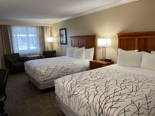 Ένα ή περισσότερα κρεβάτια σε δωμάτιο στο Best Western Plus Silver Saddle Inn