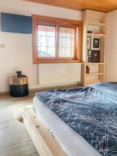Una cama o camas en una habitación de Farma Holý Vrch