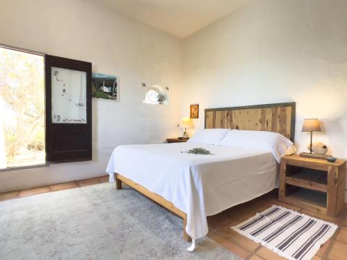 Ένα ή περισσότερα κρεβάτια σε δωμάτιο στο Can Piedrópolis