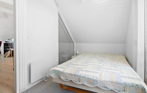 a bedroom with a bed in a white room at Gorgeous Home In Assens With Kitchen in Assens