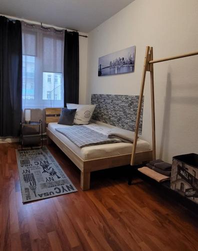 a bedroom with a bed with a swing in it at City Pension Zwickau in Zwickau