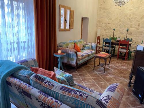 a living room with two couches and a table at Boutique B&B Suite at Casa Grande in Pinoso