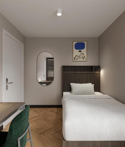 Un pat sau paturi într-o cameră la Numa Munich Obersendling