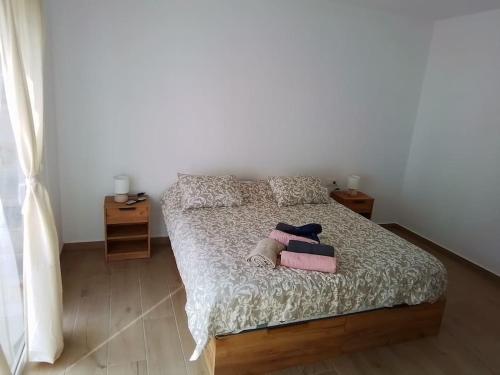 a bedroom with a bed with two towels on it at La Catumbela in Tuineje