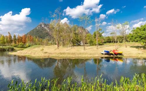 two boats sitting on the shore of a lake at Guilin Bonjour Boutique Hotel in Guilin