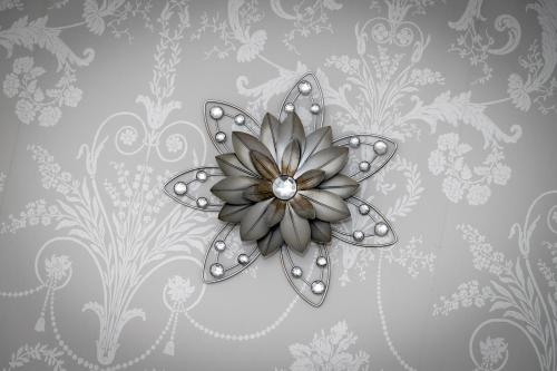 a silver flower on a gray wallpaper at The Collyweston Slater in Collyweston