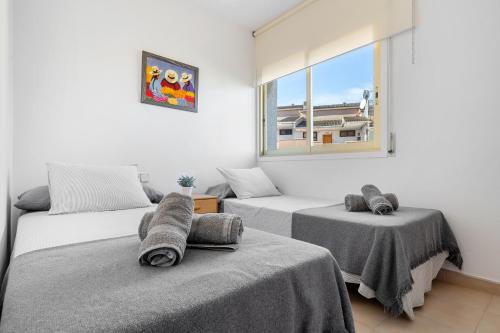 Ένα ή περισσότερα κρεβάτια σε δωμάτιο στο Apartamento Ct