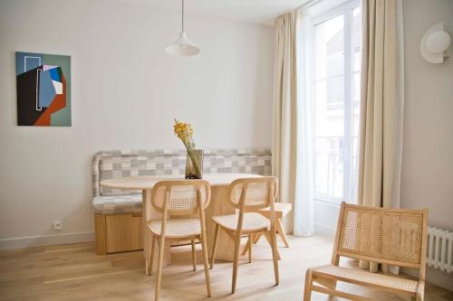 a dining room with a table and chairs at Luxury and Design Perfect Apt Mouffetard 5th in Paris