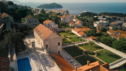 an aerial view of a village with a large house at Palace Natali in Dubrovnik