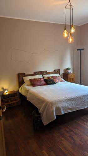 a bedroom with a large bed in a room at Casa Reggiana in Reggio Emilia