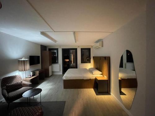 a hotel room with a bed and a mirror at Vicolo Otel in Istanbul