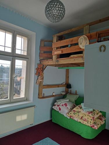 a bedroom with a bunk bed and a window at - PASTELOWY loft - in Sopot