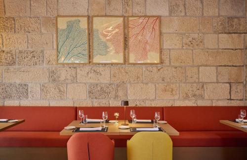 a dining room with two tables and two chairs at Palace Natali in Dubrovnik