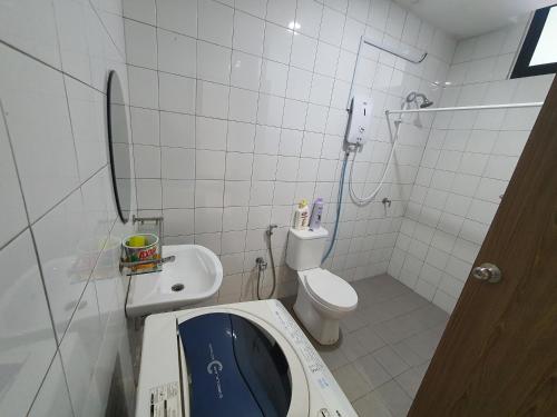 a small bathroom with a toilet and a sink at MyStudio Imperio Home , Alor Setar with sky infinity pool in Alor Setar
