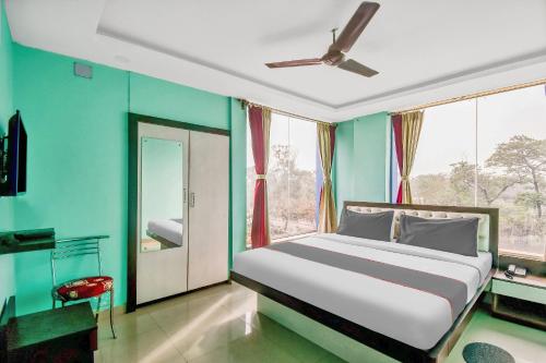 En eller flere senger på et rom på OYO Hotel Green View