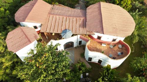 an overhead view of a house with trees at Mama Africa Art Residence & Art Center Gambia in Tanji