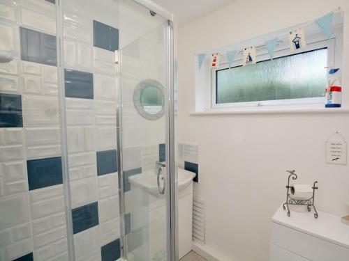 a bathroom with a shower and a toilet at 1 Bed in Charmouth 41890 in Charmouth