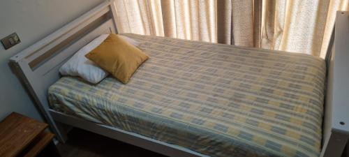 Cama o camas de una habitación en Delpino Propiedades 4 Norte, Viña del Mar