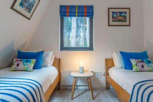 Postel nebo postele na pokoji v ubytování Reedcutter Lodge
