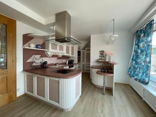 a kitchen with a sink and a counter top at Lakeside Serenity in Velden am Wörthersee