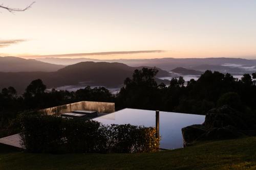a house on a hill with a view of the mountains at Cerquido by NHôme in Cerquido