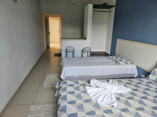 Ein Bett oder Betten in einem Zimmer der Unterkunft Pousada