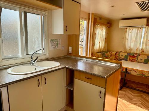 a kitchen with a sink and a counter top at Camping Fonts del Algar in Callosa d'en Sarrià