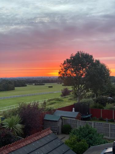 a sunset from the roof of a house at Aintree Grand National Home in Aintree
