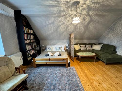 a living room with two couches and a couch at Prvorepublikový dům se zahradou in Podivín