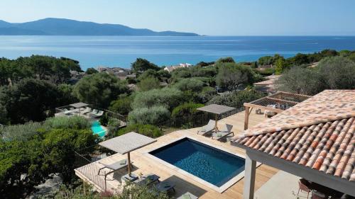 an aerial view of a house with a swimming pool at Résidence La Plage in Propriano